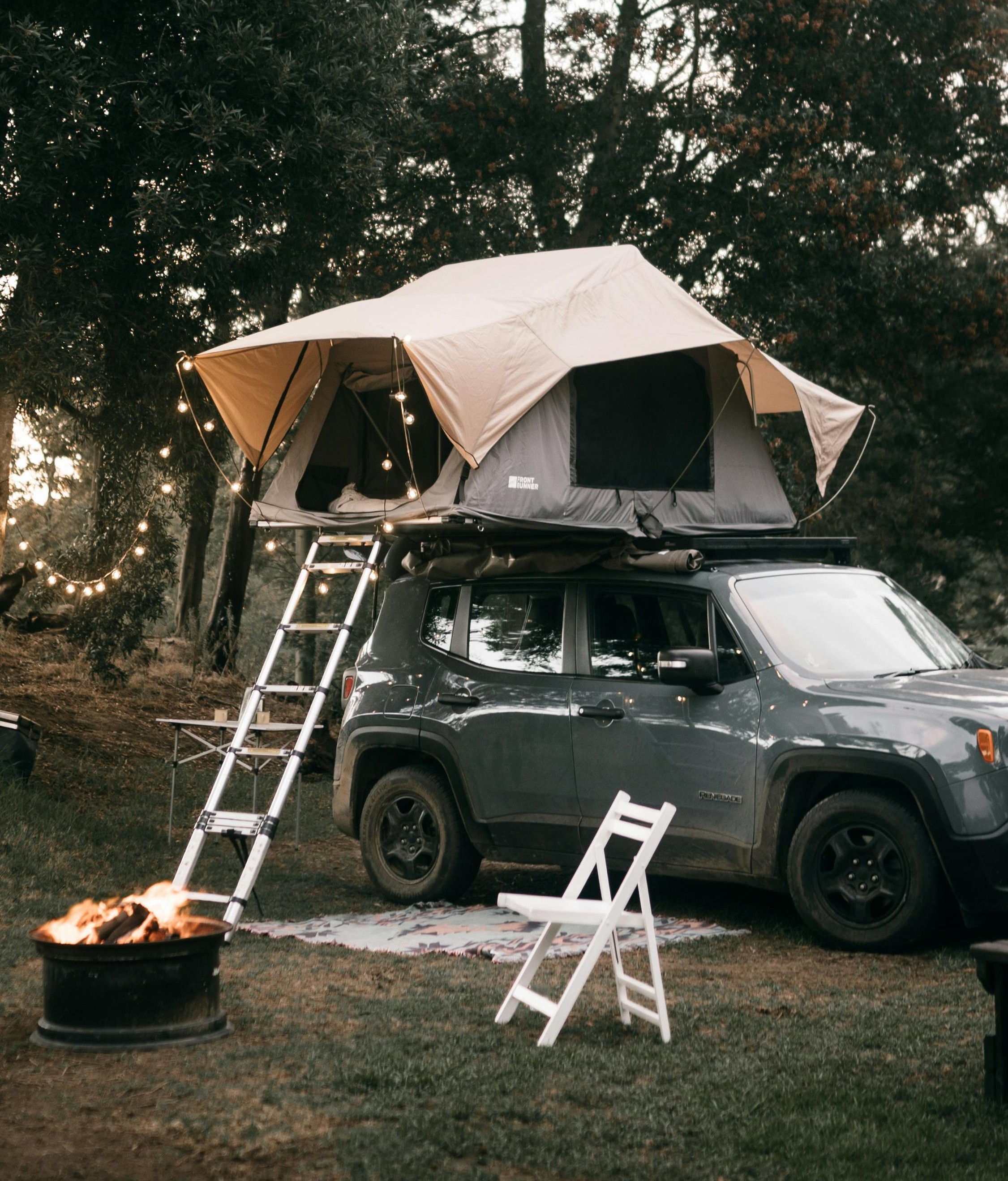 Camping scene beside a vehicle
