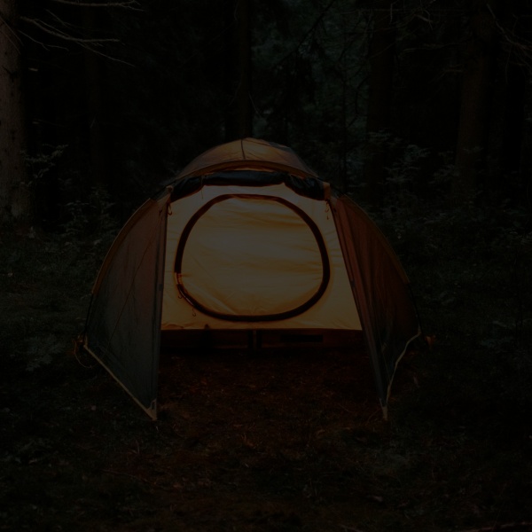 Tent beside a lake in nature